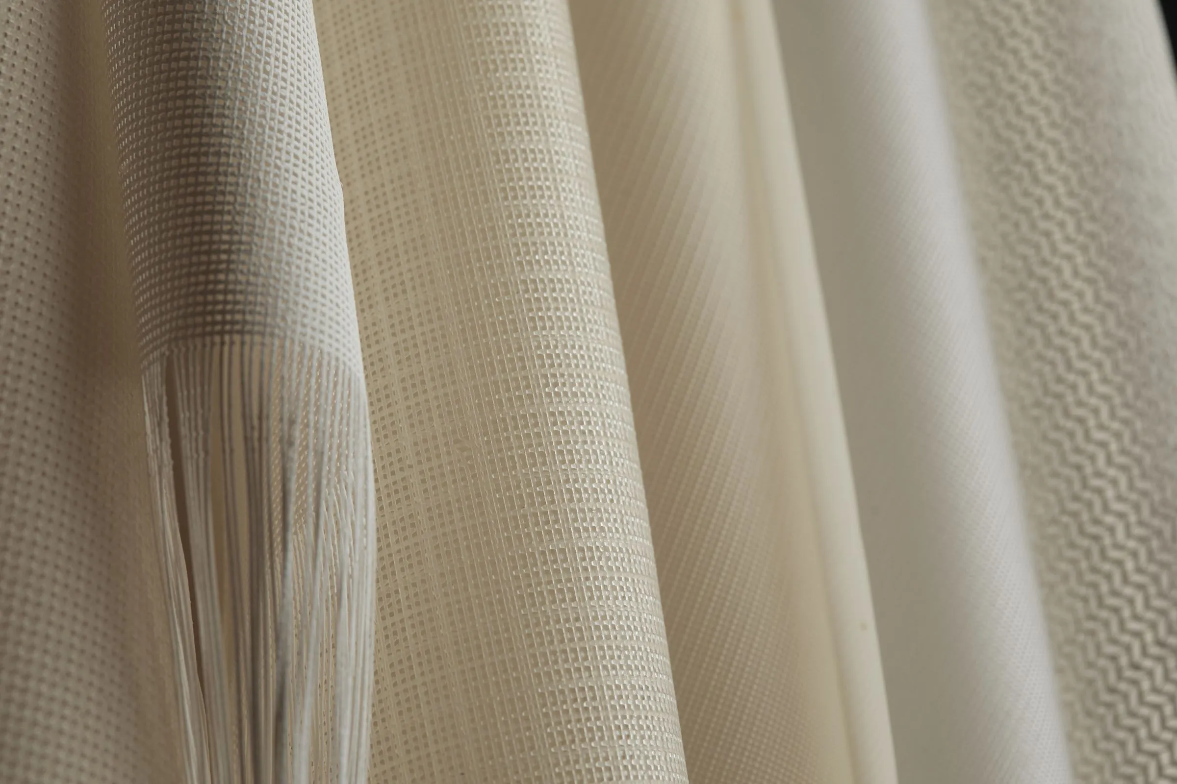 A cream printed weave hanging in soft folds